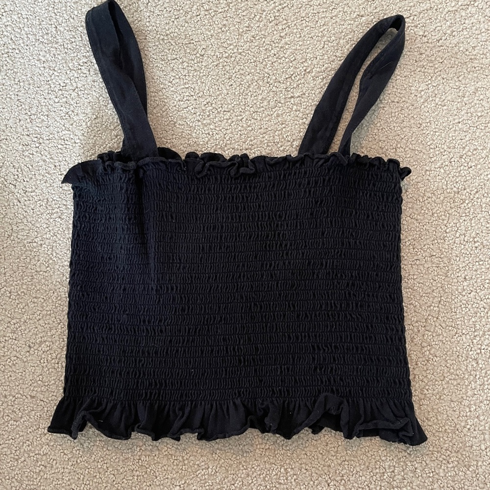 Black tank. Size small. Very stretchy so could fit medium. Adorable staple.